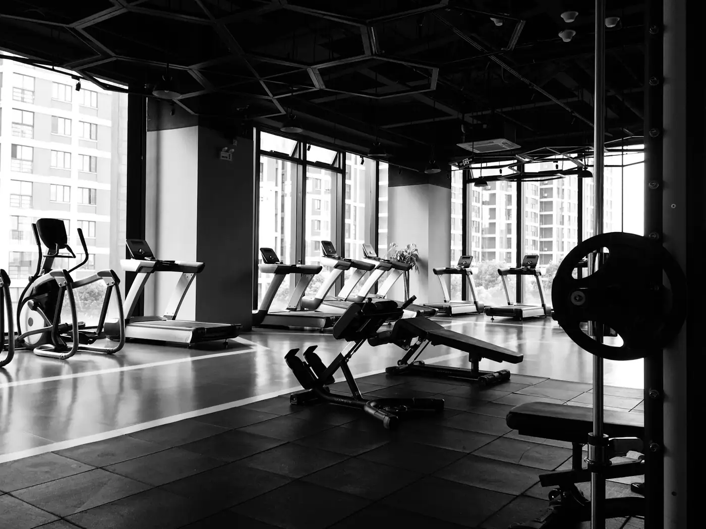 A gym with treadmills and weight-training equipment